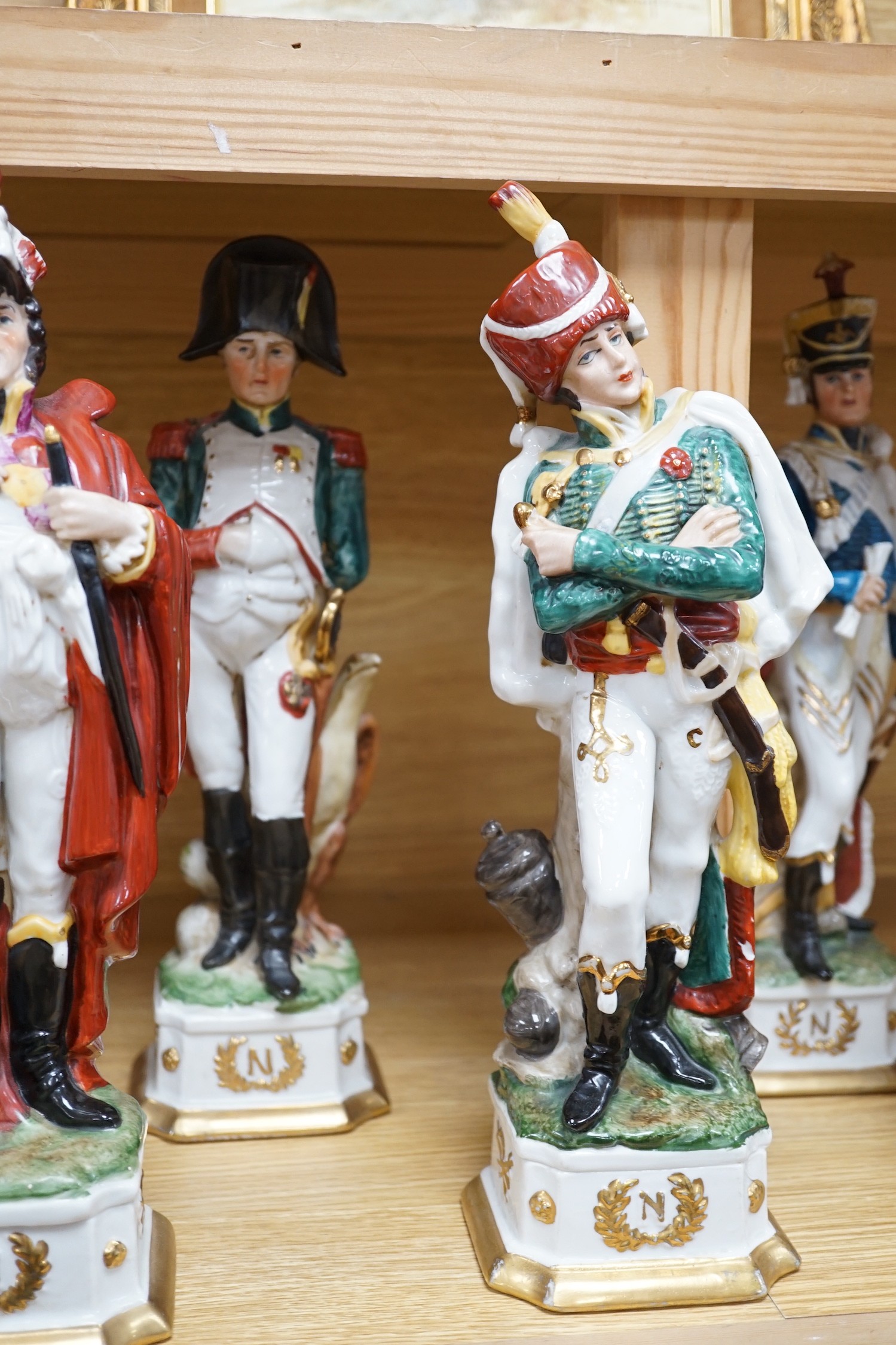 Six continental porcelain figures of soldiers, 32cm